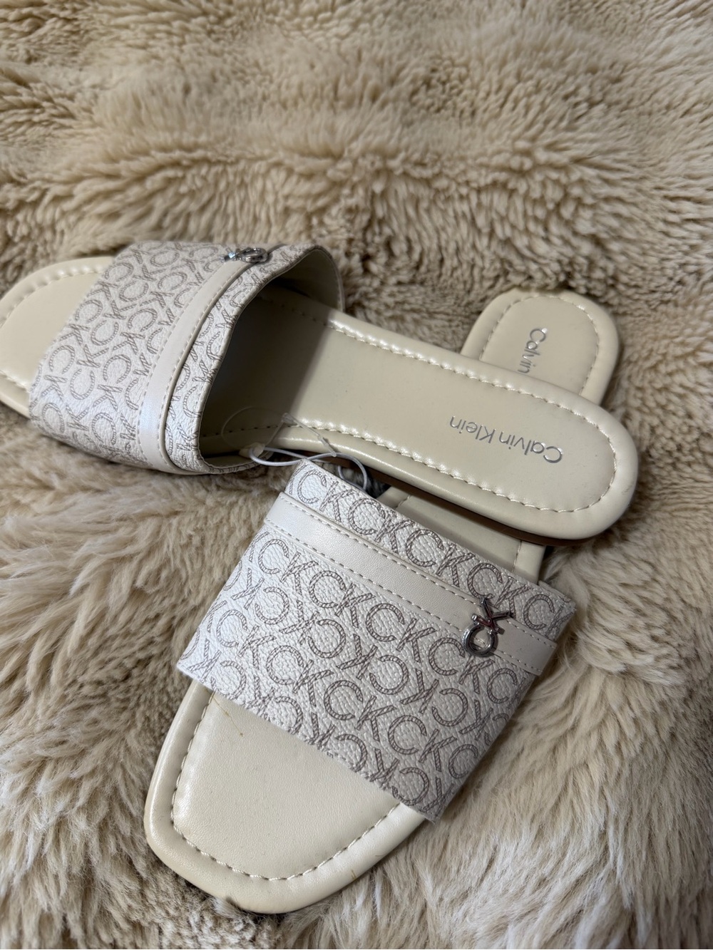 Calvin Klein Cream Monogram Slip-On Sandals with Logo Charm